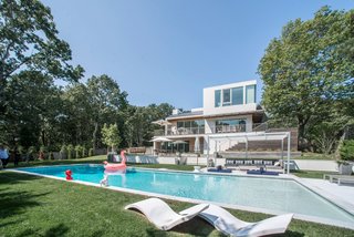 The surrounding grounds were re-landscaped to create even more privacy and garden views from the house, as well as around the tennis court and pools. 