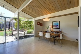 The dining area looks out over an exterior patio.