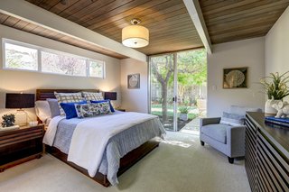 The master suite has sliding doors that lead out to the exterior patio. 
