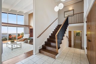 The split-level home opens to a glimpse of the breathtaking view. 