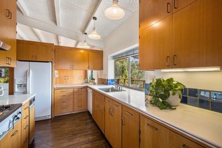 The original kitchen is simple and tasteful, yet also ripe for modern updates. 