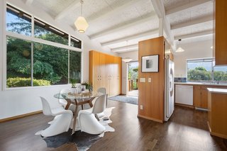 The open kitchen leads to the wraparound deck. 