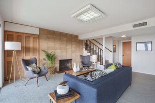 The residence also features a basement with an additional living room. 
