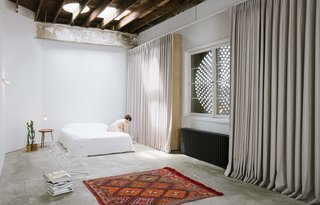 The general contractor’s former office space was converted into a small apartment dwelling for the couple.
