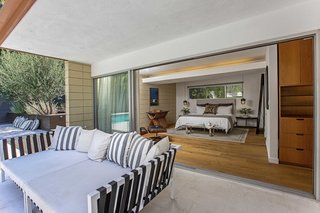 The master bedrooms open directly onto the outdoor space. 