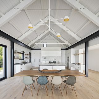 The neutral palette of the open-plan kitchen/dining feels polished and contemporary. 