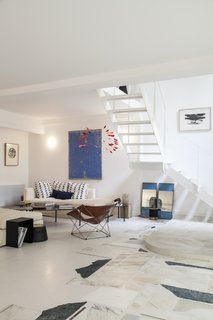 A sitting area to sit and contemplate the artwork adds a museum-like feel. 