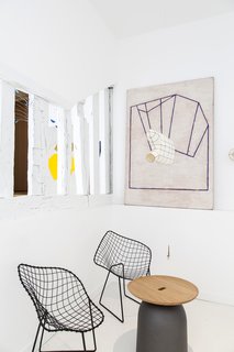 Bertoia Diamond Lounge Chairs work perfectly with the rotating collection of art. 