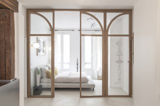 A custom-made glass door has been integrated to maximize the natural light throughout.