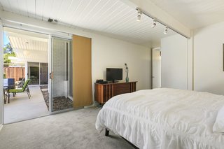 The roomy master suite has an ensuite bathroom and outdoor access. 