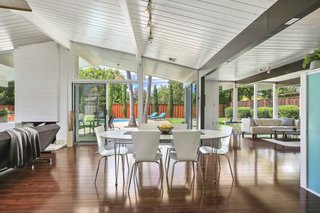 The spacious open floor plan features an impressive great room with vaulted ceilings which have been painted white. In addition to the living room and dining room area, there is also a den set just off the kitchen. 