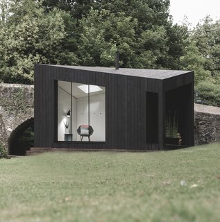 Interiors include concealed storage walls to maximize the floor space and help maintain the minimalist aesthetic. 