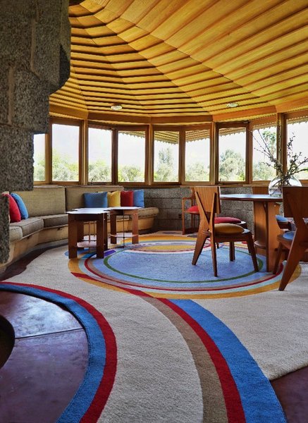 The interiors are a mix of wood, concrete blocks, and custom-designed furniture.