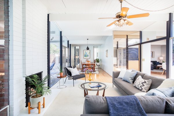 The tongue-and-groove ceiling has been painted a crisp white, helping the interiors to encompass a bright, airy feel.