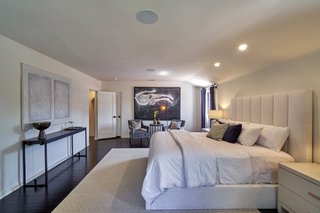 The master suite boasts dual walk-in closets and an elegant ensuite bathroom. 