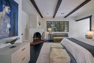 This bedroom even has its own wood-burning fireplace. 