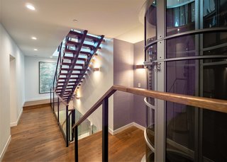 A floating staircases transports you from floor to floor—if you prefer, you can take the levitating, 52-inch cylindrical vacuum elevator.