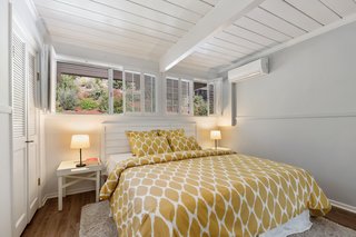 The master bedroom has an ensuite bathroom, which was completely updated in the remodel.