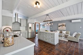 The kitchen also overlooks a casual sitting area. 