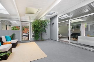 The central atrium is bright and airy, infusing beautiful natural light throughout the home. 