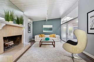 The spacious living room also receives ample natural light via the atrium.