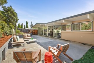 Another look at the backyard patio which showcases the elegant angle of the roofline. 