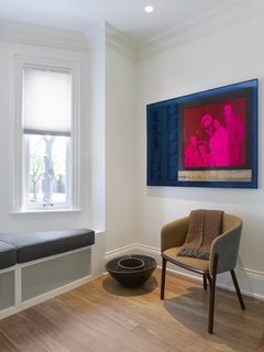 A look at the living room vignette. All original ornamental details have been pared down to fit into the context of a more modern aesthetic.