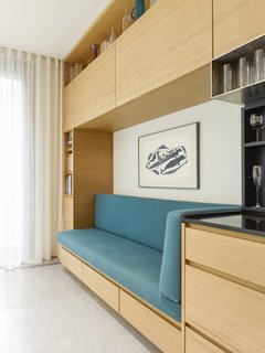 A close-up of the daybed and additional storage cabinets. 