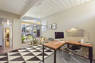 One of the four bedrooms in use as an office. This bedroom looks toward the atrium. 