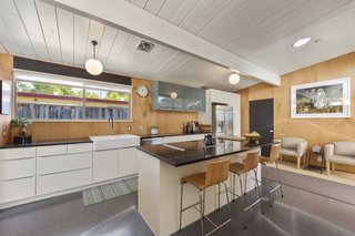 The home also features a double farmhouse sink and high-end stainless steel appliances.