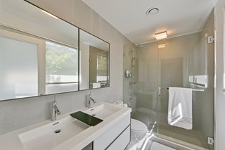 Both bathrooms are beautifully updated with porcelain flooring, plus radiant heating and cooling technology.