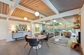 Globe pendant lighting adds an authentic midcentury touch. 