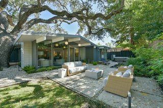 The newly landscaped yard is virtually maintenance free and features modern concrete hardscapes, as well as wood decking—perfect for alfresco entertaining. 
