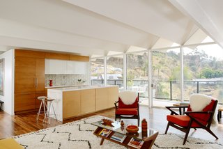 The updated kitchen offers contemporary living with a midcentury-modern vibe. 