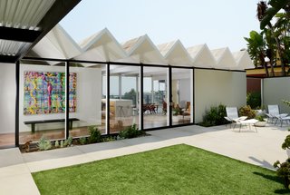 The courtyard has a serene sitting area and frames views into the house and straight through to the other side. 
