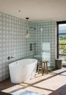 Windows allow natural light to filter into the space and also provide guests with views of the vineyard locale. 