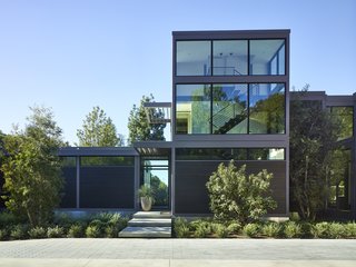 This custom residence for actor Will Arnett was inspired by LivingHomes' RK2 model. About a third was built on-site, including a glass staircase tower and a guest wing (featuring a recording booth where Will can ply his trademark baritone).