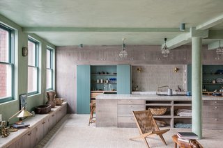 The original, steel-framed Crittall windows reference the space's past as a former shoe factory. 