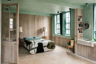 The second bedroom with woven linen shutters by Christabel Balfour.