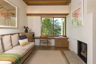 Upstairs, the third bedroom is currently configured as a cozy study—complete with a wood-burning fireplace. 