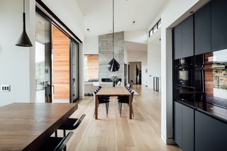 Being from Denmark, the family knew that they wanted the home to have a Scandinavian touch. White walls, clean lines, and most importantly, touches of wood throughout keep things warm and inviting. "This is a family home, not a cold art museum," says Axboe. Light oak flooring was used throughout the main level. 