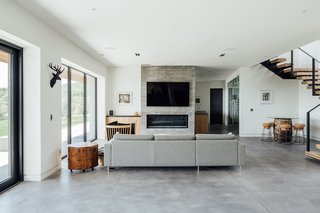 The lower level also features has a board-formed concrete fireplace. 