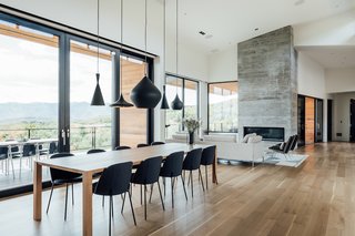 Tom Dixon's Beat pendant lighting hangs over the dining table. 
