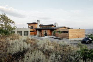 The house was designed to seamlessly integrate into its surroundings. It is conceived as a "looking box" to the mountain ranges, with ample outdoor decks and patios to enjoy the views. 