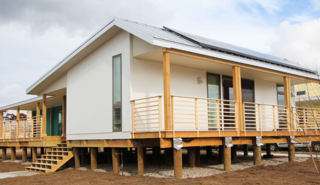 Five solar panels line the roof. 