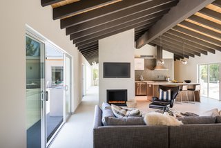 Sliding doors lead to the central courtyard, providing easy indoor/outdoor living and effortless entertaining. 