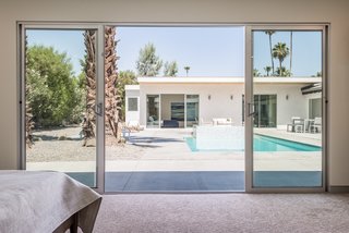 There are also sliding doors leading out to the pool. 