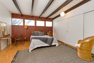 The second bedroom has doors leading to the outdoor patio. 