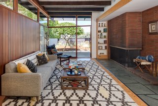 The room extends straight out to the yard, with glazing creating a seamless connection to the outdoors. 