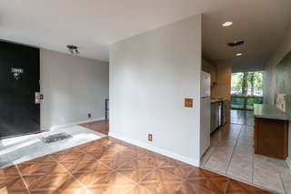 The kitchen is set just to the right of the entrance. The open plan allows light and air to circulate throughout the unit. 